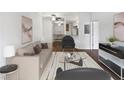 Bright living room with hardwood floors, neutral walls, and a comfy sofa at 200 Renaissance Ne Pkwy # 302, Atlanta, GA 30308