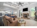Spacious living room with stone fireplace, high ceilings, and hardwood floors at 1068 W Union Grove Cir, Auburn, GA 30011
