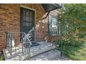 Inviting front door entrance to a brick home with steps and railing at 5678 Kingsport Dr, Sandy Springs, GA 30342