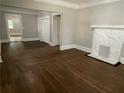 Spacious living room with hardwood floors and fireplace at 916 Cascade Sw Rd, Atlanta, GA 30311