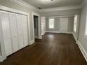 Hardwood floors and high ceilings in this spacious living room at 916 Cascade Sw Rd, Atlanta, GA 30311