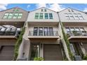 Three-story townhouses with balconies and landscaping at 697 Eustace Se St, Atlanta, GA 30315