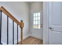 Bright entryway with wood stairs and neutral color scheme at 3405 Ripple Loop # 127, South Fulton, GA 30349