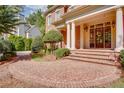 Elegant entryway with brick walkway, columns, and double doors at 2761 Major Ridge Trl, Duluth, GA 30097