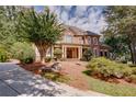 Brick house exterior with a large front porch and landscaping at 2761 Major Ridge Trl, Duluth, GA 30097