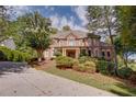 Brick house exterior with a large front porch and landscaping at 2761 Major Ridge Trl, Duluth, GA 30097