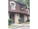 Condo building exterior, brown roof, tan siding, landscaping, and walkway at 2968 Parc Lorraine, Lithonia, GA 30038