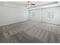 Spacious bedroom with carpet flooring and two large windows at 368 Madison Grace Ave, Mcdonough, GA 30252