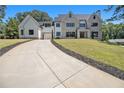 Curving driveway leading to a luxurious two-story home at 2731 Ridgewood Nw Rd, Atlanta, GA 30327