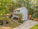 Two story house with attached garage and deck at 1073 Boston Rdg, Woodstock, GA 30189