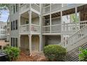 Condo exterior showcasing multiple units and staircases at 608 Abingdon Way, Atlanta, GA 30328