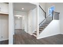 Hardwood floors and open concept view into the living and dining area at 6300 Misty Hill Ln, Buford, GA 30518