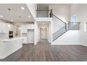 Two-story living room with hardwood floors, fireplace and open staircase at 6300 Misty Hill Ln, Buford, GA 30518