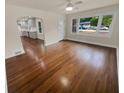 Living room with hardwood floors and an open view of the kitchen at 1955 S Columbia Pl, Decatur, GA 30032