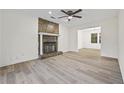 Living room with stone fireplace and LVP flooring at 1008 King Rd, Riverdale, GA 30296