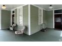 Spacious front porch with vintage chairs at 490 Hill Se St, Atlanta, GA 30312