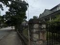 Home with stone wall and wrought iron fence at 490 Hill Se St, Atlanta, GA 30312
