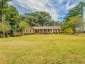 Charming ranch home with large yard and mature trees at 1152 Harbins Rd, Dacula, GA 30019