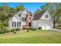 Two-story house with white siding and a two-car garage at 2506 Hollindale Nw Ln, Kennesaw, GA 30152