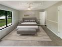 Virtually staged bedroom with a neutral color palette and modern furniture at 3551 Mill Glen Dr, Douglasville, GA 30135