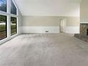 Spacious living room with large windows and a fireplace at 3551 Mill Glen Dr, Douglasville, GA 30135