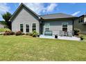 Charming patio with seating area and well-manicured lawn at 310 Ellington Dr, Canton, GA 30115