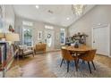 Bright dining area with wood table and chairs, hardwood floors, and natural light at 86 Bryan St, Mcdonough, GA 30253