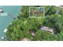 Lakefront property with private dock and lush surroundings at 5775 Lakeshore Dr, Buford, GA 30518