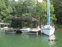 Private boat dock with lift and floating platform at 5775 Lakeshore Dr, Buford, GA 30518