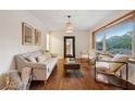 Living room with hardwood floors, sofa and armchairs at 822 Gertrude Nw Pl, Atlanta, GA 30318