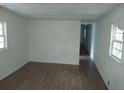 Bright living room with wood flooring and beadboard walls at 64 Luther Knight Se Rd, Cartersville, GA 30121