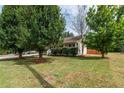 One-story house with attached garage and mature landscaping at 13 Beechwood Ln, Rockmart, GA 30153