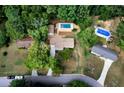 Aerial view showcasing the property, pool, and surrounding neighborhood at 4770 Shady Rest Dr, Powder Springs, GA 30127