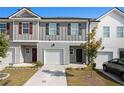 Two-story townhome with attached garage and landscaping at 3511 Lakeview Crk, Lithonia, GA 30038