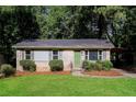Brick ranch house with a green door and carport at 3523 Se Garfield Se Way, Atlanta, GA 30354