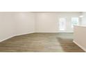 Bright living area with hardwood floors and access to back patio at 6393 Shadow Sq, Lithonia, GA 30058