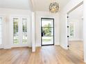 Bright entryway with hardwood floors, glass front door and French doors at 6175 River Shore Pkwy, Atlanta, GA 30328