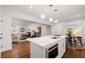 Open concept kitchen with island and microwave at 58 Peachtree Memorial Nw Dr # 1, Atlanta, GA 30309