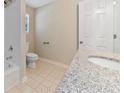 Updated bathroom with granite countertop and tile flooring at 1870 Rocksram Dr, Buford, GA 30519