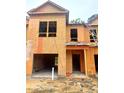 Two-story townhome under construction, showcasing a modern design and attached garage at 6194 Ripple Way # 86, South Fulton, GA 30349