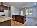 Modern kitchen with granite island and stainless appliances at 6198 Ripple Way # 87, South Fulton, GA 30349