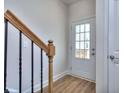 Interior entryway with wood stairs and door at 6198 Ripple Way # 87, South Fulton, GA 30349