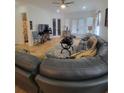 Spacious living room featuring a large sectional sofa and hardwood floors at 727 Cascade Sw Ave, Atlanta, GA 30310