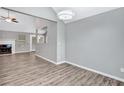 Open dining room with gray walls and wood floors at 735 Kilkenny Cir, Lithonia, GA 30058