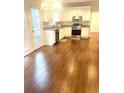 Spacious kitchen with hardwood floors and stainless steel appliances at 221 Larkshyre Trl, Lawrenceville, GA 30043