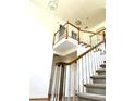 Elegant two-story entryway with a grand staircase at 221 Larkshyre Trl, Lawrenceville, GA 30043