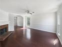 Bright living room with hardwood floors and a fireplace at 2959 Heather Lake Dr, Austell, GA 30106