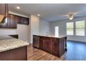 Modern kitchen with granite countertops and island at 6210 Ripple Way # 90, South Fulton, GA 30349