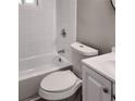 Clean bathroom with white tiled walls and a white toilet and bathtub at 2900 Bradmoor Ct, Decatur, GA 30034