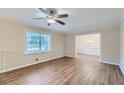 Living room with hardwood floors and view to dining area at 3993 Snapfinger Way, Decatur, GA 30035